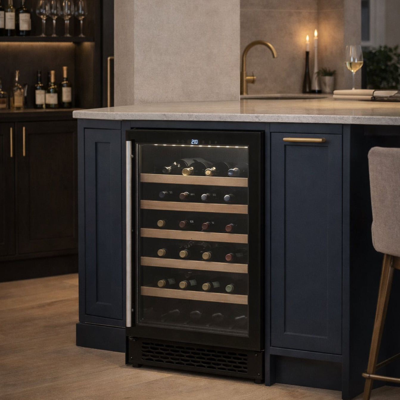 Wine cooler integrated into a kitchen setting with wine bottles and glasses.