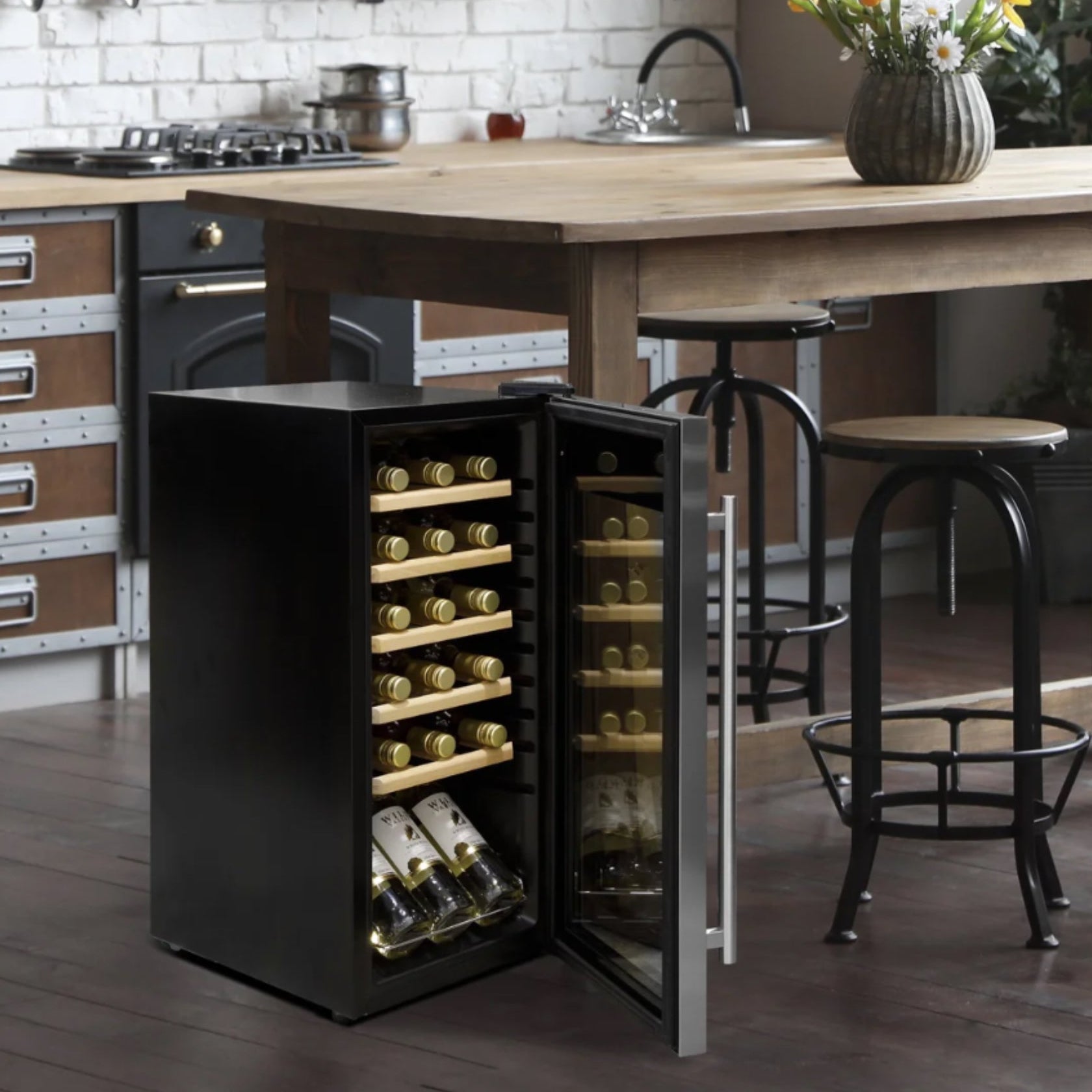 Wine cooler integrated into a kitchen island with bottles inside, surrounded by bar stools.