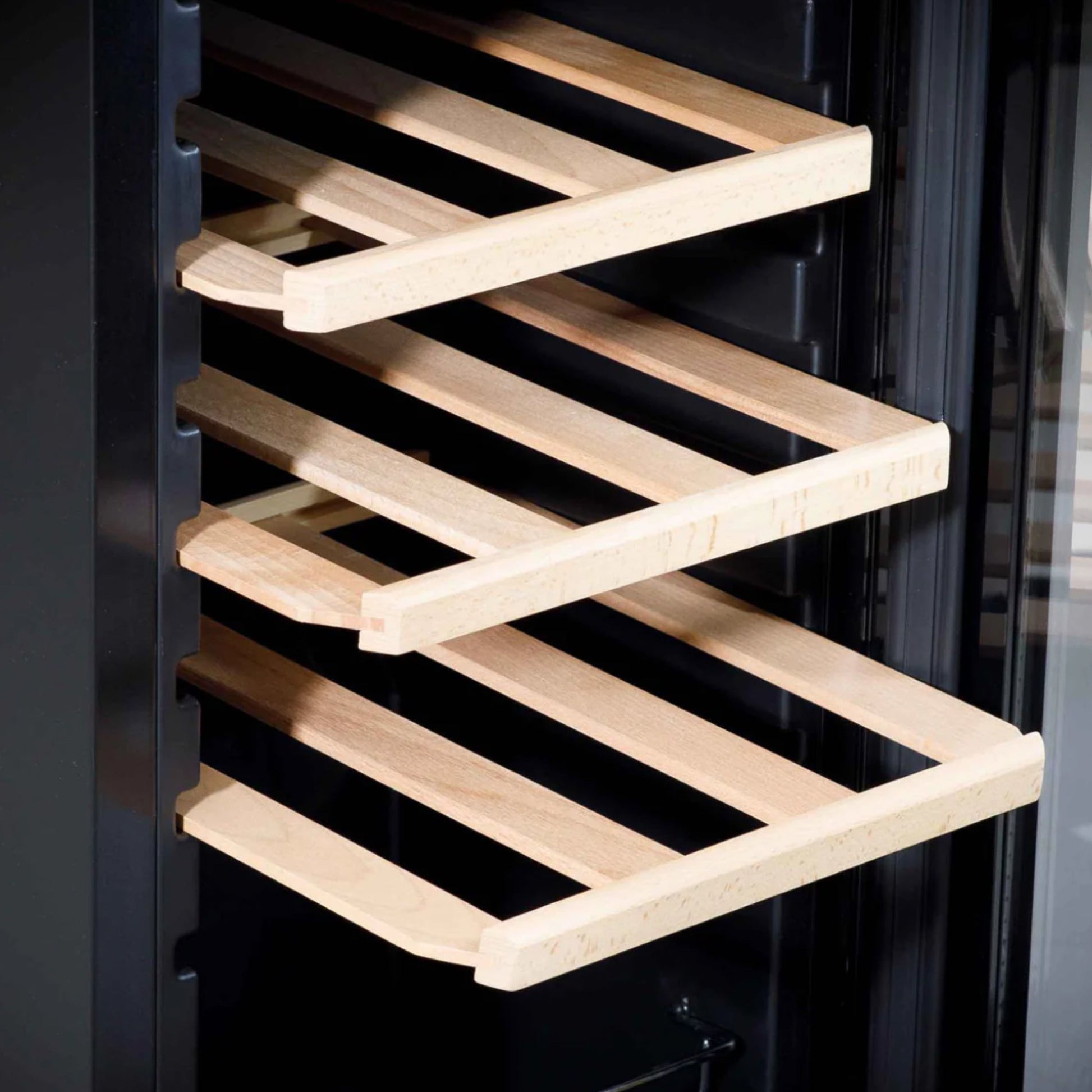 Wooden wine rack inside a black wine cooler