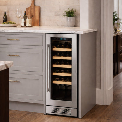 Wine cooler integrated into a kitchen with gray cabinets and marble countertops.