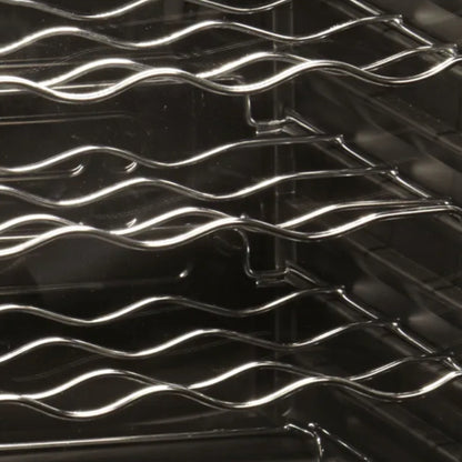 Metallic grill with wavy design on a black background