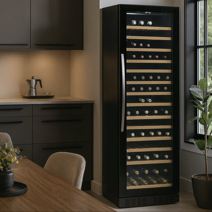 Black wine cooler in a modern kitchen setting with wooden table and chairs.