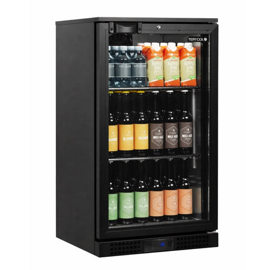 Black beverage cooler with glass door displaying various bottles on a white background